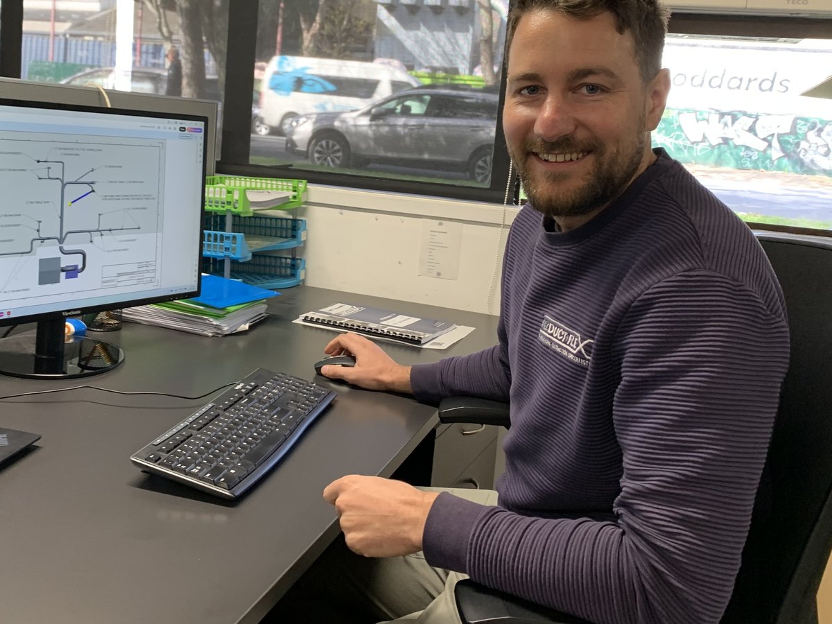 George Matusek reviewing a duct system CAD layout